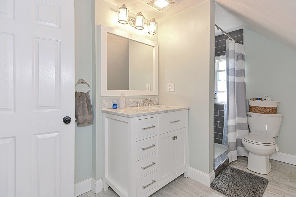 122 Mendon Road Sutton, MA 01590 - Photo 21 of 36 a bathroom with a granite countertop sink toilet and shower