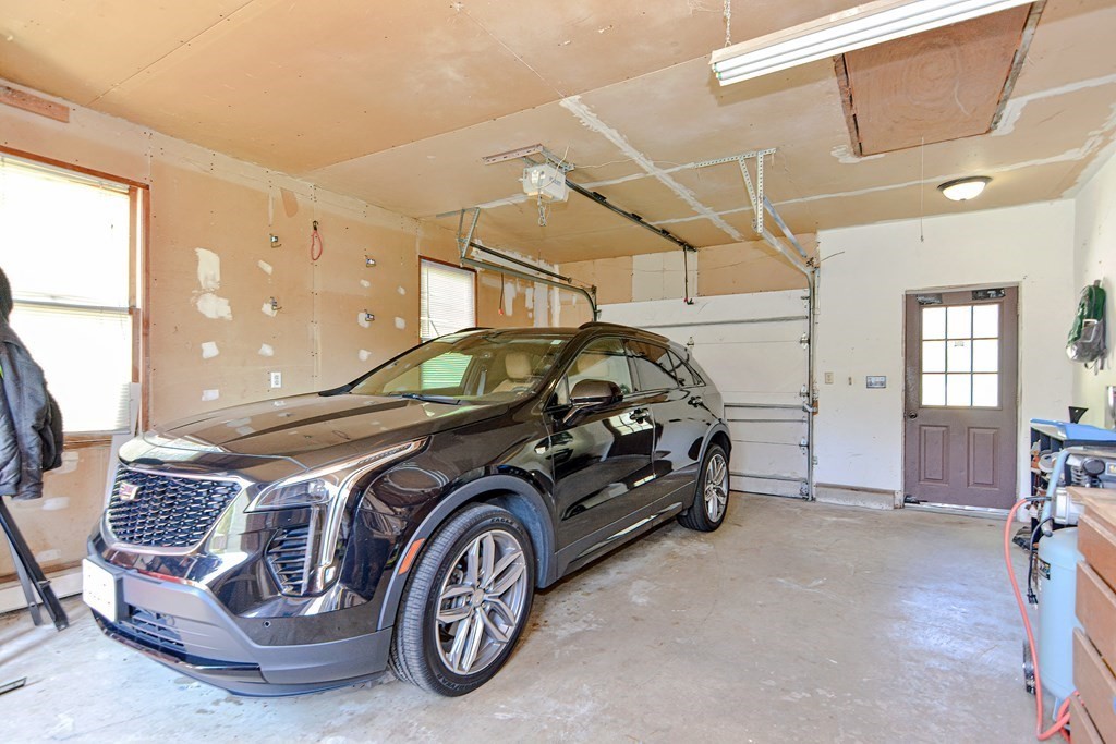 122 Mendon Road Sutton, MA 01590 - Photo 27 of 36 a car parked in a garage