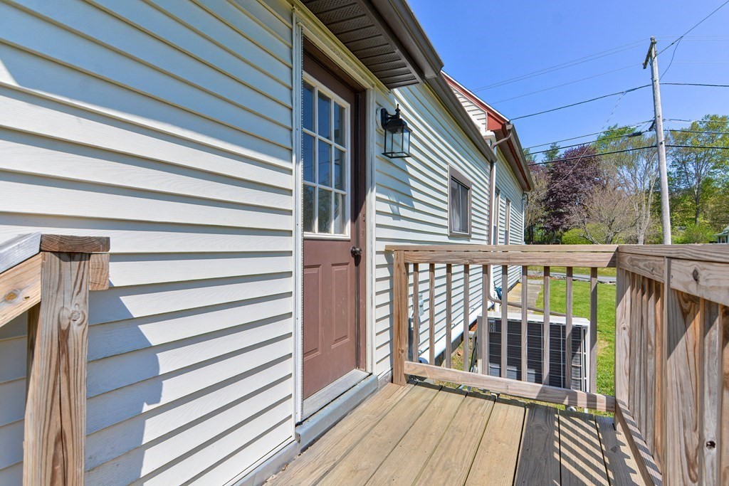 122 Mendon Road Sutton, MA 01590 - Photo 29 of 36 a view of a wooden deck
