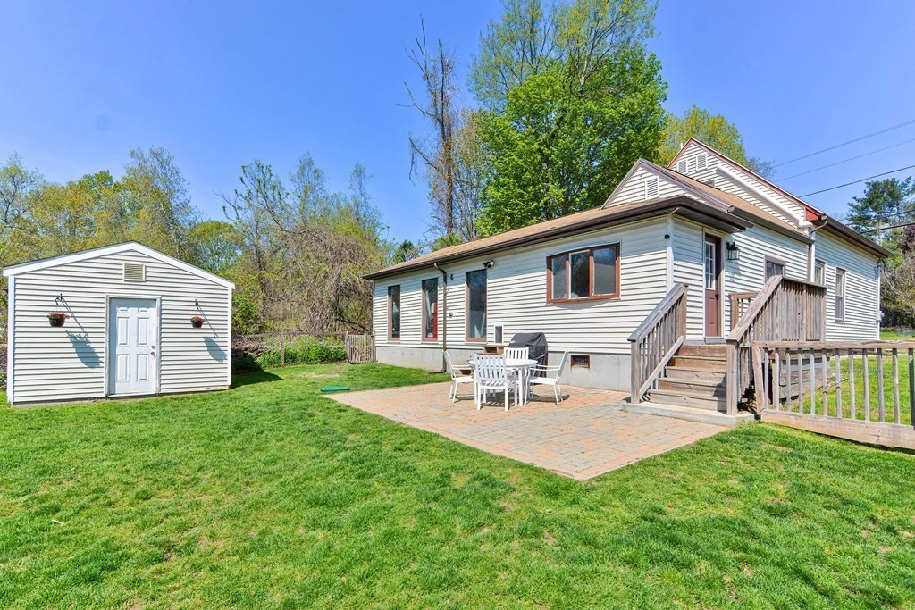 122 Mendon Road Sutton, MA 01590 - Photo 3 of 36 a view of a house with a yard and deck