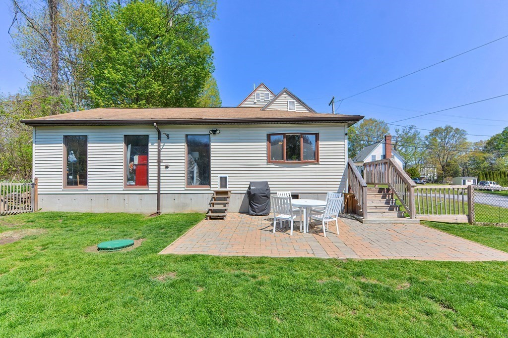 122 Mendon Road Sutton, MA 01590 - Photo 32 of 36 a view of a house with a yard and plants