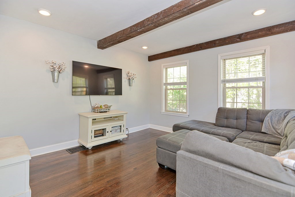 122 Mendon Road Sutton, MA 01590 - Photo 4 of 36 a living room with furniture and a flat screen tv
