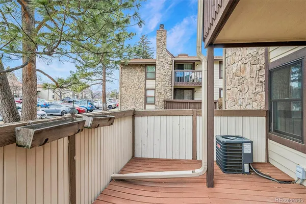 a view of a chair and table in the balcony