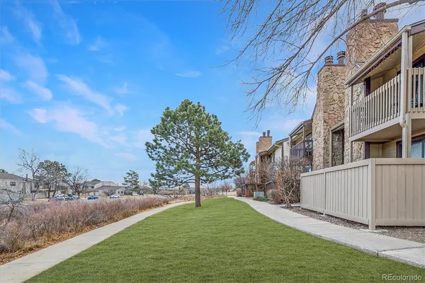 a view of backyard with green space
