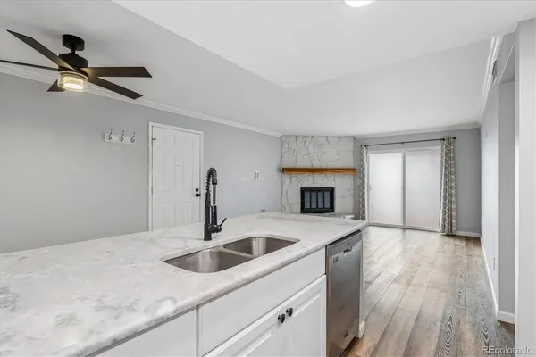 a kitchen with sink and cabinets