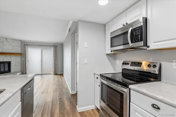 a kitchen with a stove and a microwave