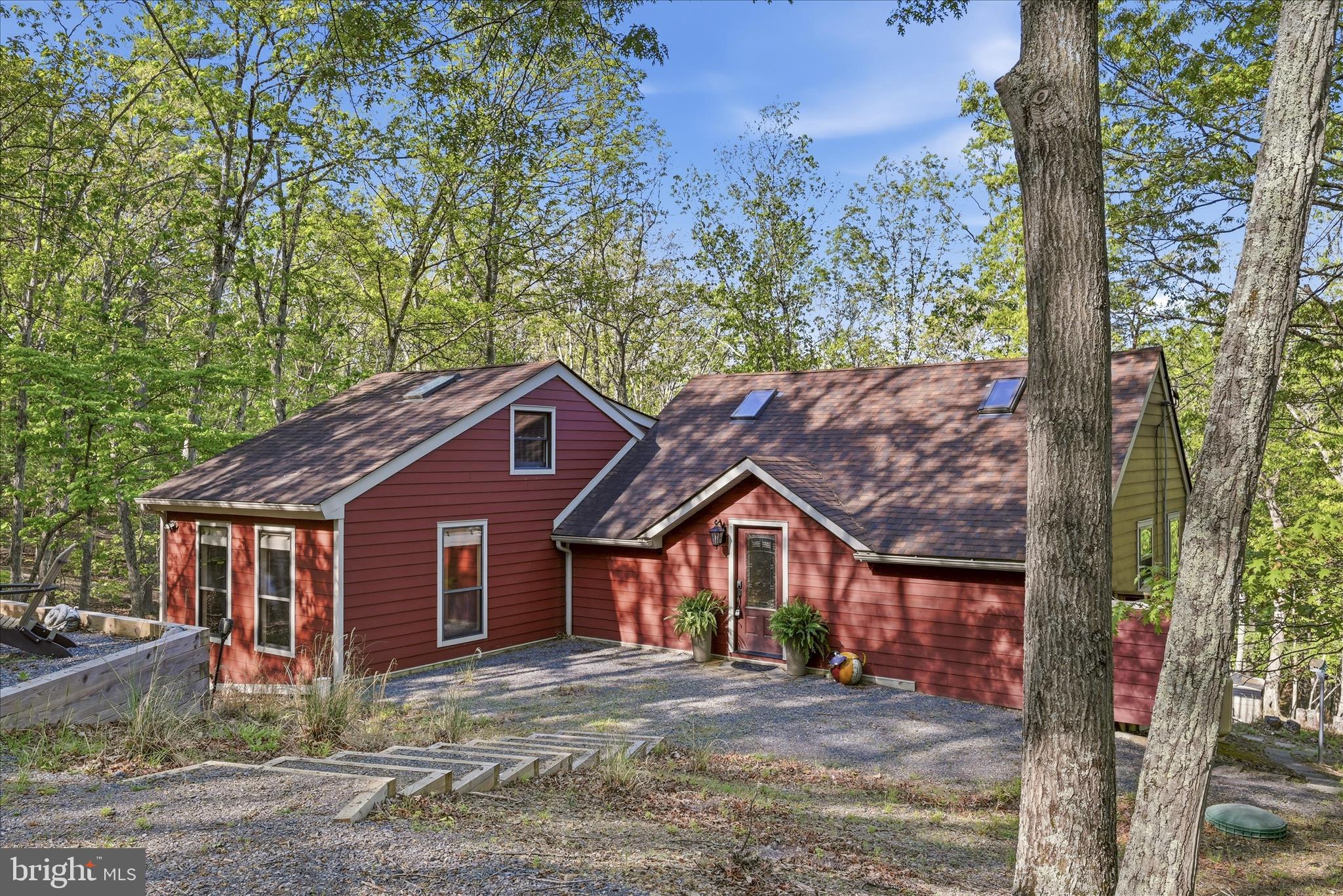 1856 Crossings View Road Paw Paw, WV 25434 - Photo 41 of 45 a front view of a house with a yard and large tree
