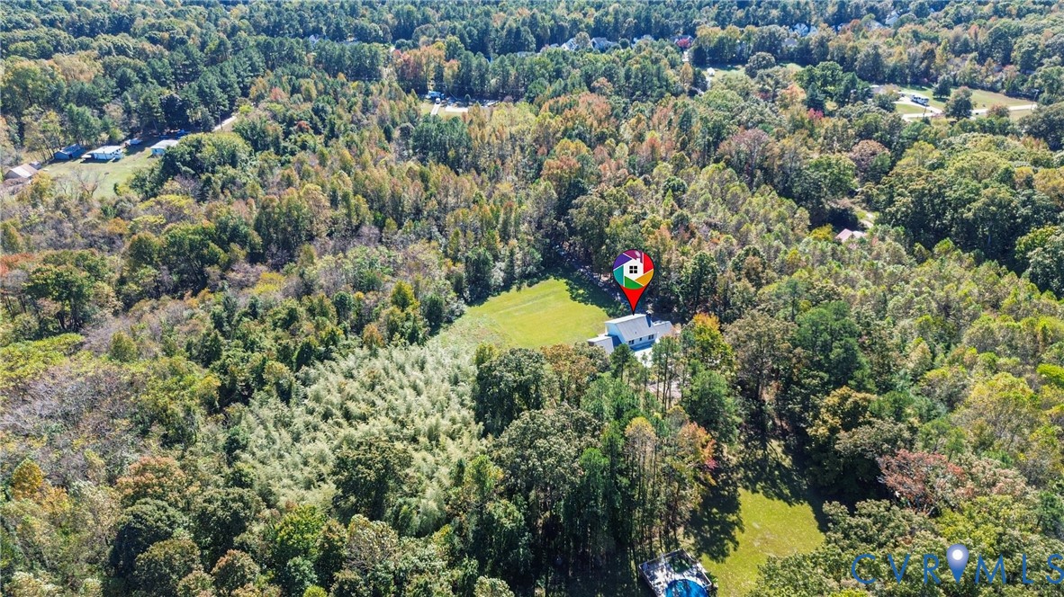 13225 Old Happy Hill Road Chester, VA 23831 - Photo 23 of 24 a view of a flower garden with a tree