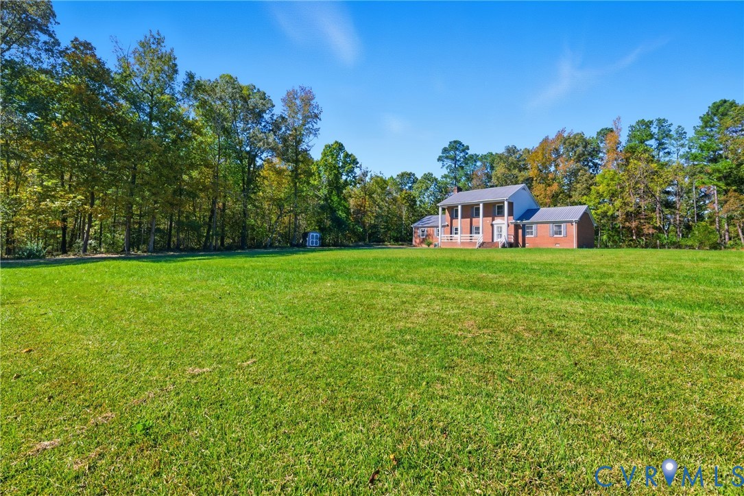 13225 Old Happy Hill Road Chester, VA 23831 - Photo 5 of 24 a house view with a garden space