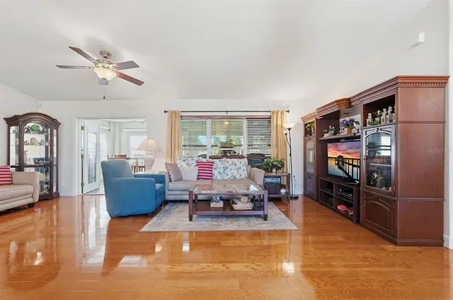 a living room with fireplace furniture and a flat screen tv