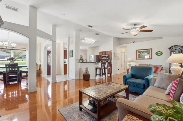 a living room with furniture and a table