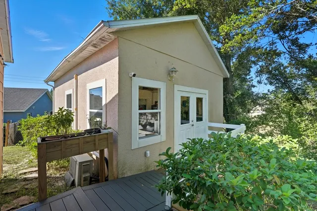 a front view of house with yard and sitting area