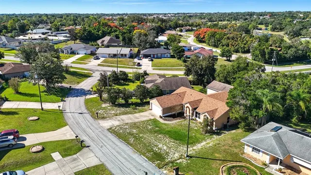 an aerial view of residential houses with outdoor space