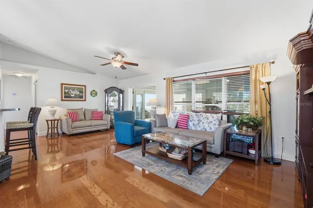 a living room with furniture rug and window
