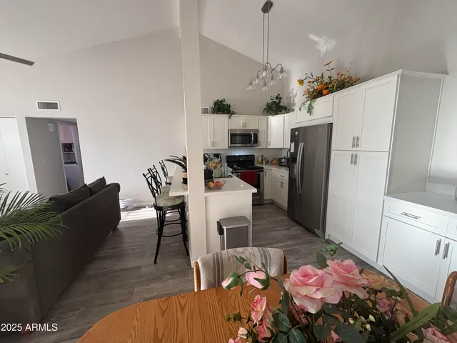 a very nice looking dining room with wooden floor