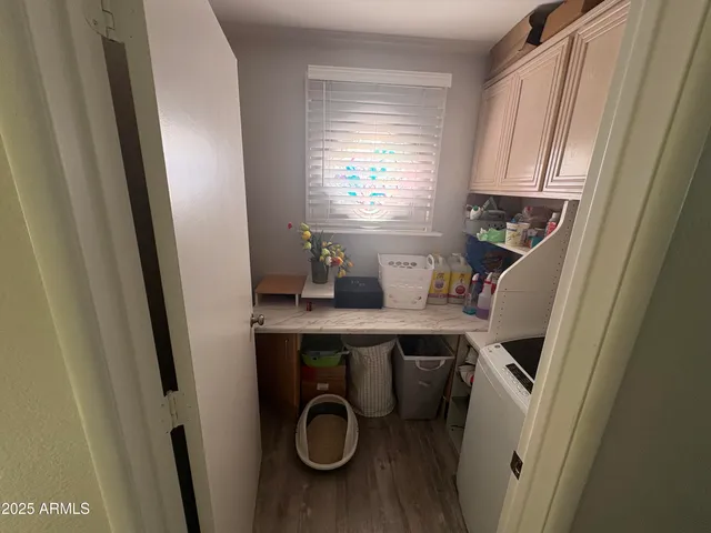 a view of dining room with a window and wooden floor