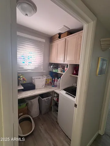 a kitchen with a sink a stove a microwave a refrigerator and cabinets