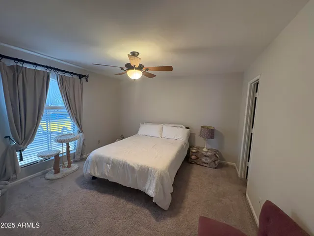 a room with a bed and a chandelier