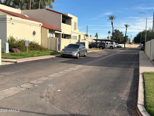 a view of street with parked cars