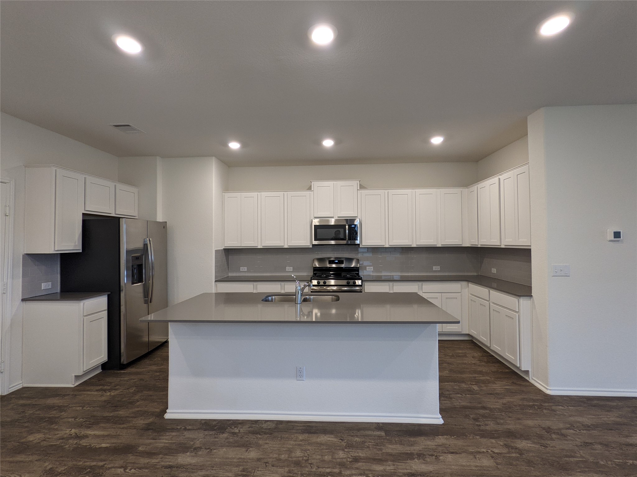 100 Montauk Loop Georgetown, TX 78628 - Photo 6 of 21 Culinary dreams come alive in this kitchen, featuring stainless steel appliances and an oversized island.