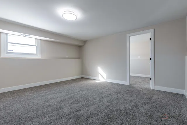 an empty room with a empty space and windows