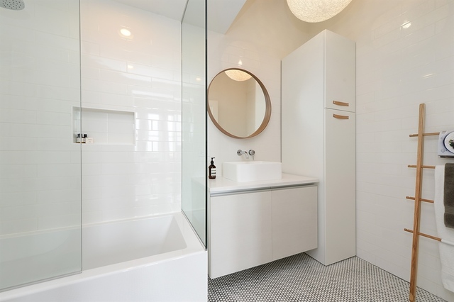 Undisclosed Address Chicago, IL 60607 - Photo 15 of 19 a bathroom with a sink a toilet and a mirror