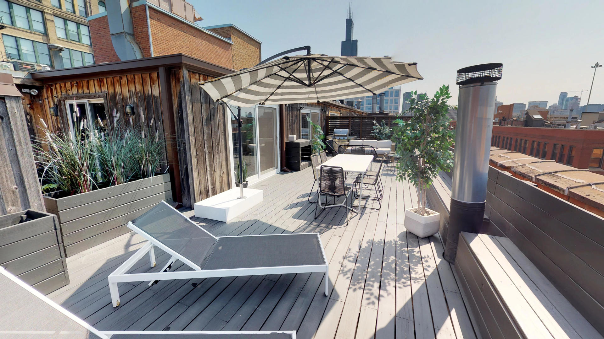 Undisclosed Address Chicago, IL 60607 - Photo 17 of 19 a view of a patio with couches table and chairs