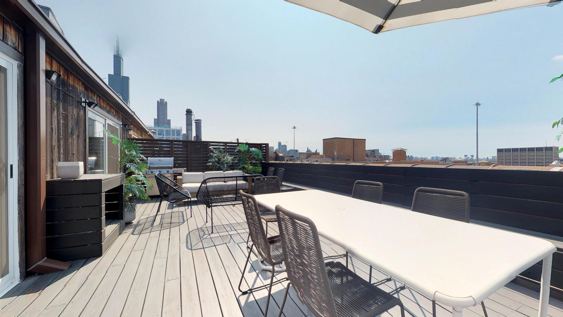 Undisclosed Address Chicago, IL 60607 - Photo 19 of 19 a view of a balcony dining table and chairs