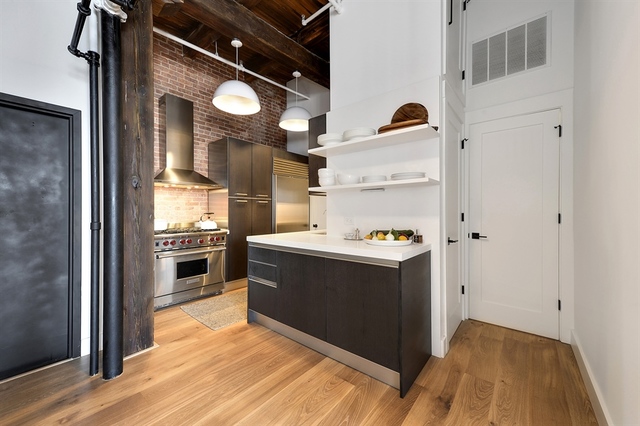 Undisclosed Address Chicago, IL 60607 - Photo 5 of 19 a view of a kitchen with wooden floor