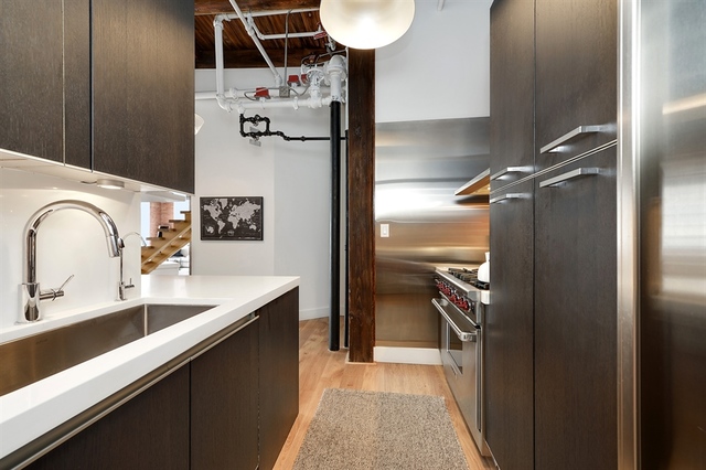 Undisclosed Address Chicago, IL 60607 - Photo 6 of 19 a bathroom with a sink and a mirror