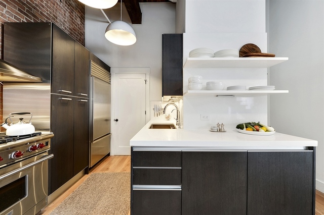 Undisclosed Address Chicago, IL 60607 - Photo 7 of 19 a kitchen with a sink a refrigerator and wooden floor