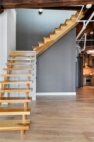 Undisclosed Address Chicago, IL 60607 - Photo 9 of 19 a view of walk in closet with empty racks