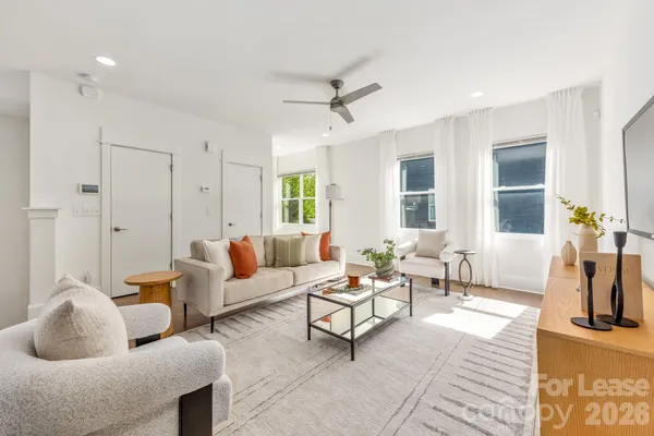 a living room with furniture and a window