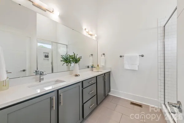 a bathroom with a glass shower door