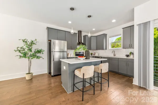 a kitchen with refrigerator and a counter