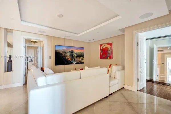a living room with couch and a flat screen tv
