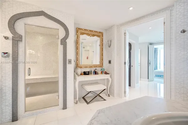 a bedroom with a bed and a mirror