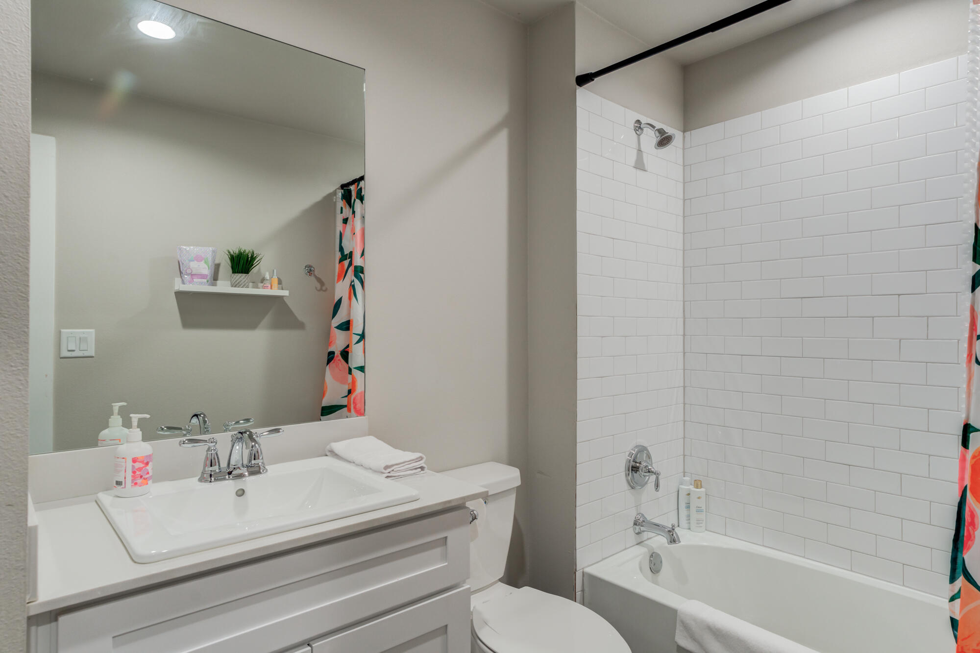 4613 126th Street Lubbock, TX 79424 - Photo 34 of 37 a bathroom with a sink mirror toilet and bathtub