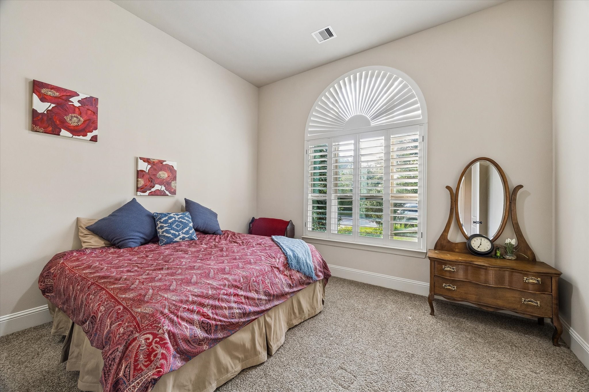 3 Tiburon Court Spring, TX 77389 - Photo 20 of 34 The private secondary bedroom on the main floor, offering comfort and flexibility for every stage of life. Whether it's a welcoming retreat for overnight guests, a space for grandparents, an older child seeking a little more privacy, or even a second home office, this room is perfectly positioned to provide both convenience and separation from the rest of the home.