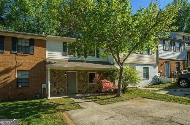 a front view of a house with garden