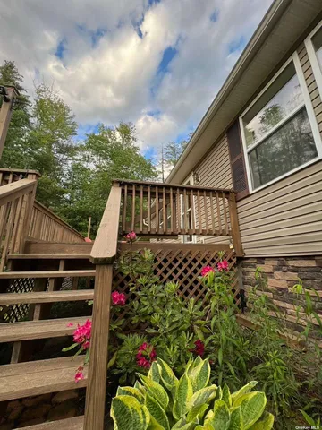 a view of a backyard with sitting area