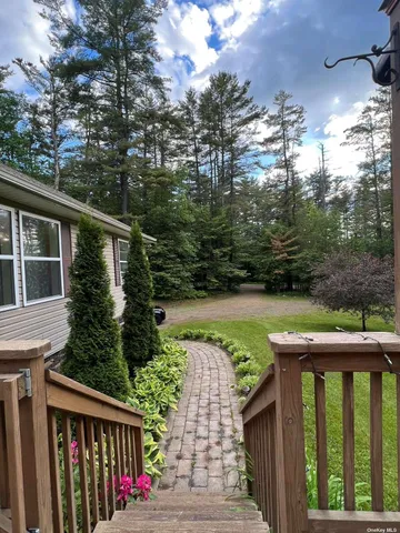 a view of street from balcony