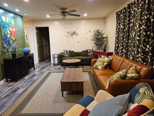 a living room with furniture and a rug