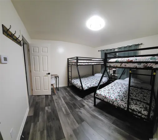 a bedroom with bed and a window
