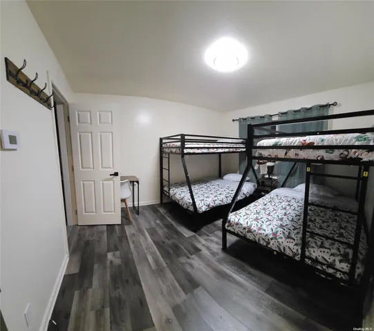 a bedroom with bed and a window