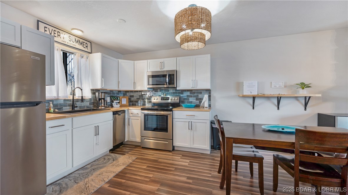 5499 3 Seasons Road, Unit C10 Osage Beach, MO 65065 - Photo 5 of 25 Beautifully updated kitchen: new cabinets, butcher