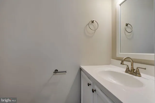a bathroom with a sink and mirror