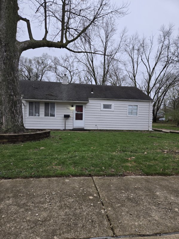 1505 West Columbia Avenue Champaign, IL 61821 - Photo 1 of 8 a view of a house with a yard