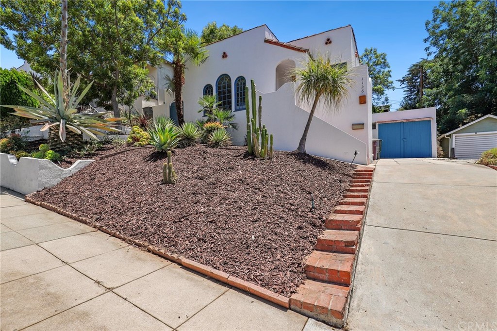 1126 Scofield Drive Glendale, CA 91205 - Photo 1 of 49 a view of a house with a yard and sitting area