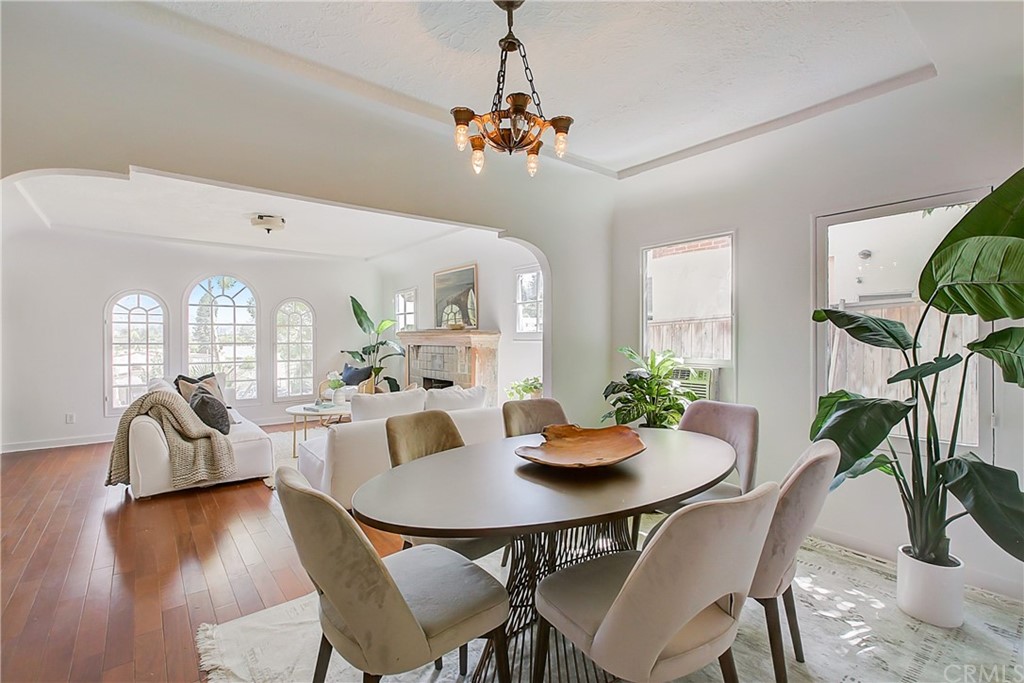 1126 Scofield Drive Glendale, CA 91205 - Photo 11 of 49 a dining room with furniture potted plants and wooden floor